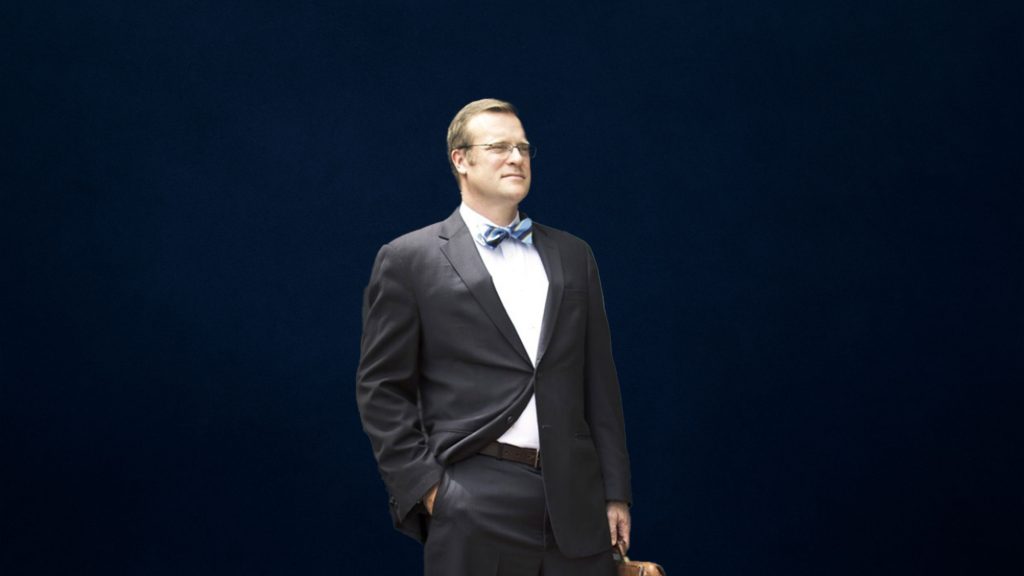 Background image for Tim Rayne Law -- Kennett Square Car Accident Lawyer featuring Tim Rayne on a blue background.